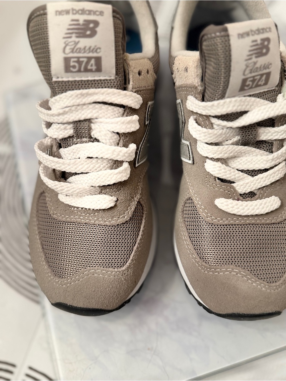 Classic New Balance 574 sneakers in a versatile gray color Women’s US size 7.5